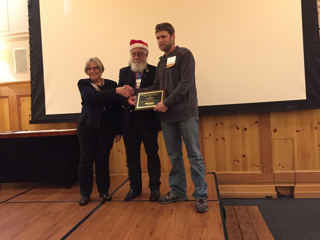Clallam County PUD Journeyman Lineman Joe Helvey (right) is presented the Good Samaritan Award by Washington Public Utility Districts Association President Dennis Reid (middle) and Pacific County PUD Commissioner Diana Thompson (left).